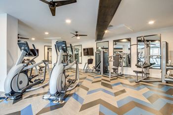 Fitness center with Peleton® spin studio at Spoke Apartments in Atlanta, GA
